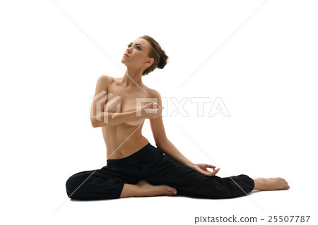 Topless woman engaged in yoga. Isolated on white 25507787
