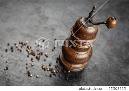Pepper grinder on dark background 25508315