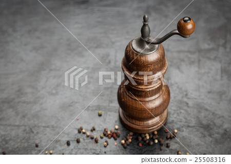 Pepper grinder on dark background 25508316