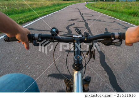 Mountain biking down hill  on bicycle. 25511616