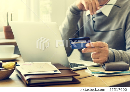 Senior Adult Holding Credit Card Concept 25517600