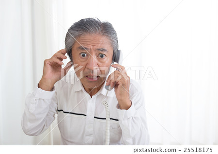 Elderly people talking on a landline phone Elderly people talking on a landline phone 25518175