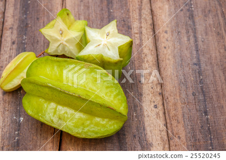 Starfruit on wooden background Starfruit on wooden background 25520245