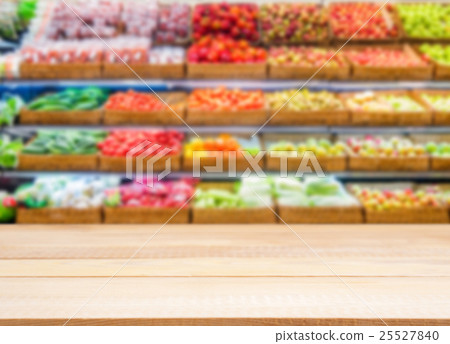 Wooden empty table in front of blurred supermarket Wooden empty table in front of blurred supermarket 25527840