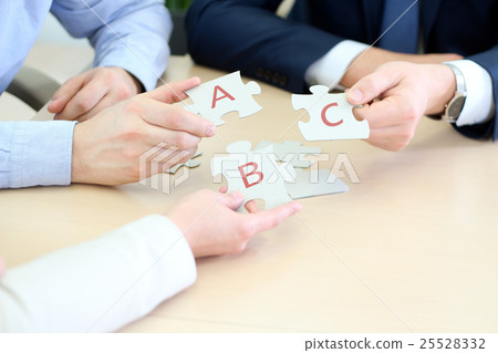 Businessmen Hand Connecting Jigsaw Puzzle Businessmen Hand Connecting Jigsaw Puzzle 25528332