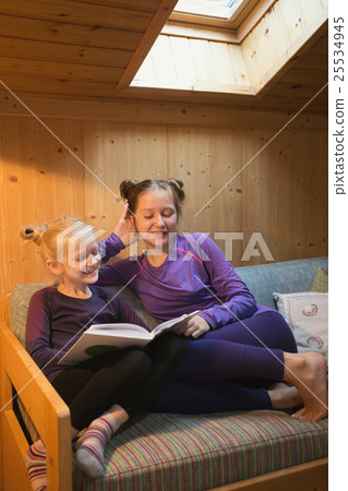 girls reads book 25534945