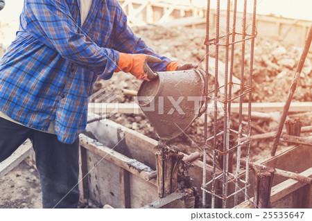man worker mixing cement mortar plaster 25535647