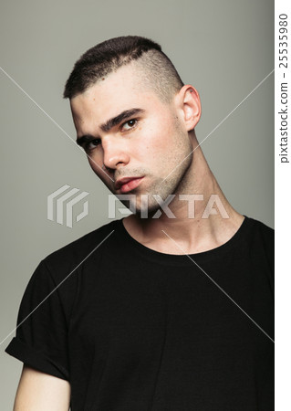 Close up studio shot of brutal guy. 25535980