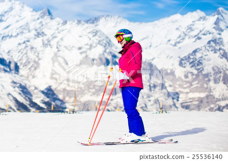 Young woman skiing in the mountains. Young woman skiing in the mountains. 25536140