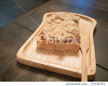 shredded dried pork toast on wood tray 25540765