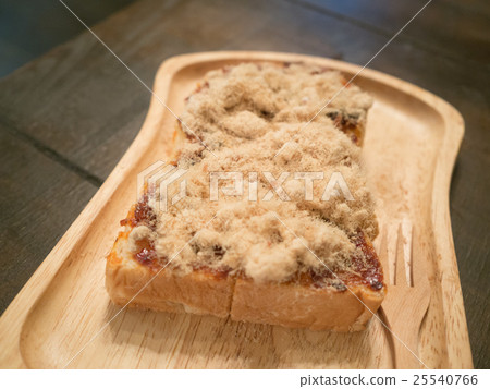 shredded dried pork toast on wood tray 25540766