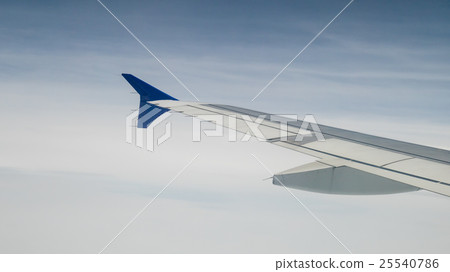 The airplane wing on the beautiful cloudy and sky. 25540786