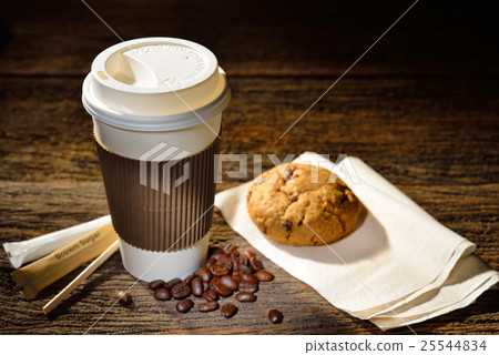 Paper cup of coffee and cookie on wooden table Paper cup of coffee and cookie on wooden table 25544834