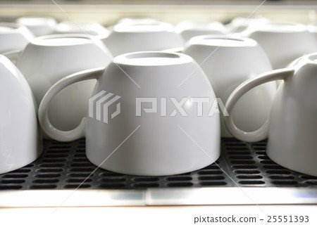 Close-up empty coffee cup on coffee machine Close-up empty coffee cup on coffee machine 25551393