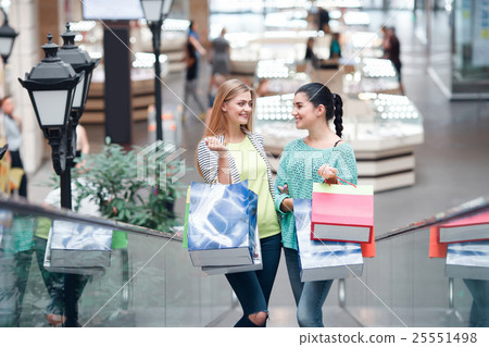 Women on the moving staircase 25551498