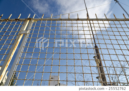 Old rusty wire fence with a depth of field 25552762
