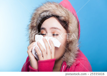 young Woman blowing her nose 25555816