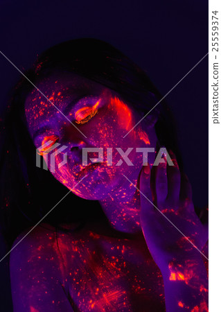Portrait of beautiful girl with ultraviolet paint on her face. G Portrait of beautiful girl with ultraviolet paint on her face. G 25559374