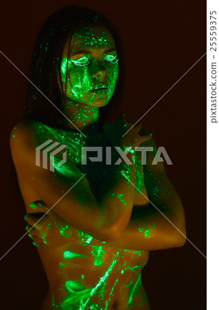 Portrait of beautiful girl with ultraviolet paint on her face. G Portrait of beautiful girl with ultraviolet paint on her face. G 25559375