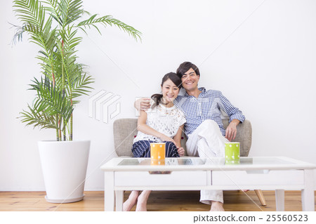 Male and female sitting side by side Male and female sitting side by side 25560523