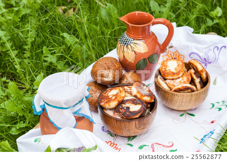 Dairy products on the embroidered white cloth. Dairy products on the embroidered white cloth. 25562877
