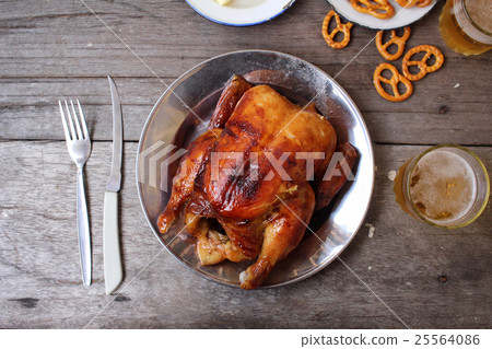 Chicken roasted and pretzels with beer in party Chicken roasted and pretzels with beer in party 25564086
