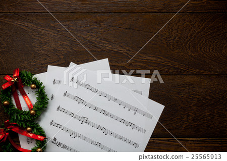 Christmas music note paper  with Christmas wreath. 25565913