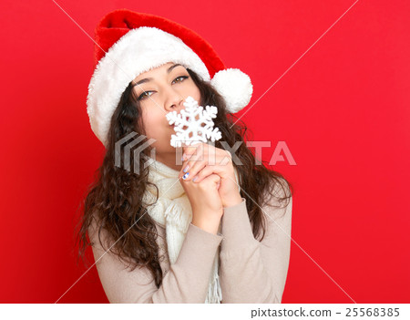 girl in santa hat portrait, new year holiday 25568385