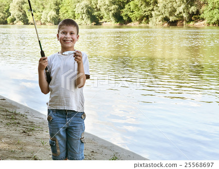 boy catch fish on bait, child camping and fishing boy catch fish on bait, child camping and fishing 25568697
