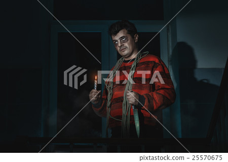 Horrible man with a knife. 25570675