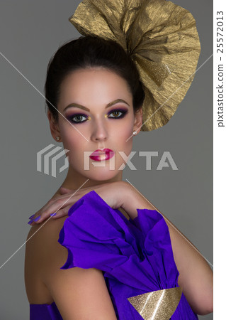 Brunette girl with purple make-up Brunette girl with purple make-up 25572013
