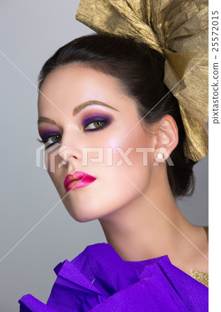 Brunette girl with purple make-up Brunette girl with purple make-up 25572015