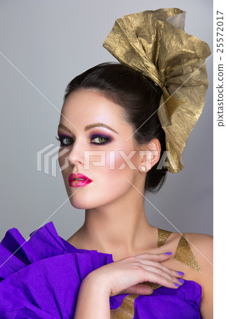 Brunette girl with purple make-up Brunette girl with purple make-up 25572017