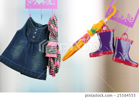 Fashion baby dresses hanging on a hanger 25584555