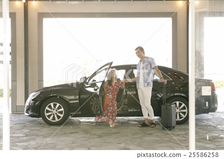 Men and women getting off the car Men and women getting off the car 25586258