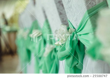 Mint bows and white cloth flowers put  25588747
