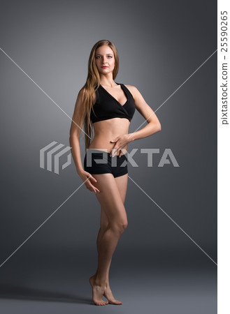 Fitness. Attractive caucasian girl poses at camera 25590265