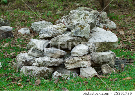 Stack of stones on the grass Stack of stones on the grass 25591789