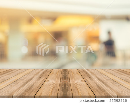 Wooden board empty table blur in department store Wooden board empty table blur in department store 25592316