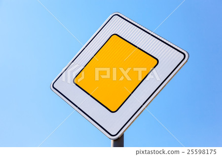 Traffic signs main road against the blue sky   25598175