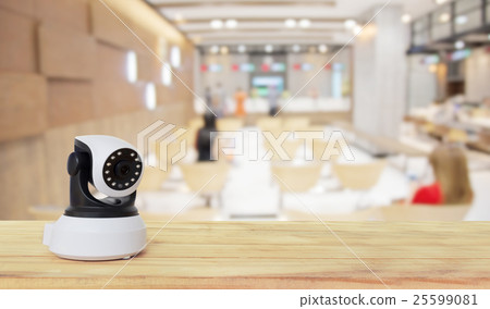 Security camera on Wood table. IP Camera. Security camera on Wood table. IP Camera. 25599081