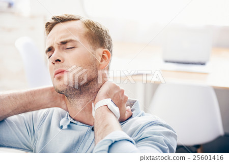 Cheerless man sitting on the couch 25601416