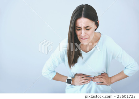 Beautiful sad woman suffering from stomachache. 25601722