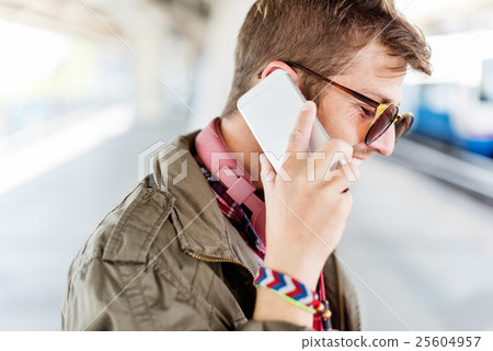Young Man Outdoors Talking Smartphone Concept 25604957