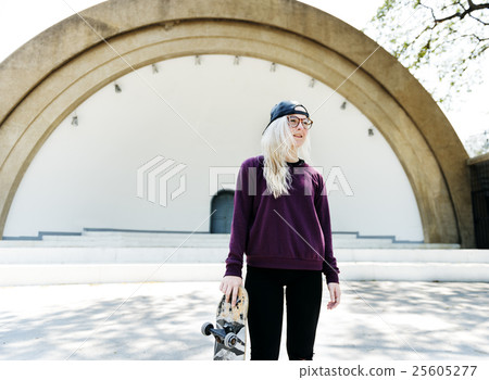 Young Woman Skateboard Standing Outdoors Bridge Concept 25605277