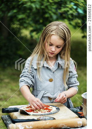 Small Girl Cooking Pizza Concept Small Girl Cooking Pizza Concept 25606812