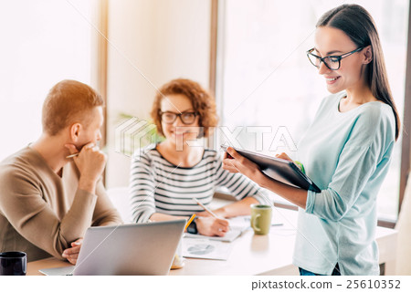 Pleasant woman working in the office Pleasant woman working in the office 25610352