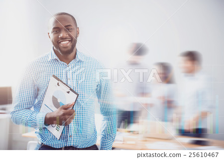 Vivacious bearded guy with folder on blurred Vivacious bearded guy with folder on blurred 25610467