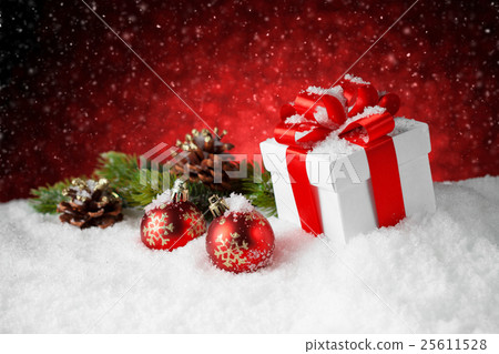 Christmas gift box and decoration on snow Christmas gift box and decoration on snow 25611528