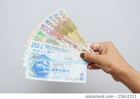 hand with Hong Kong dollar bills 25612331